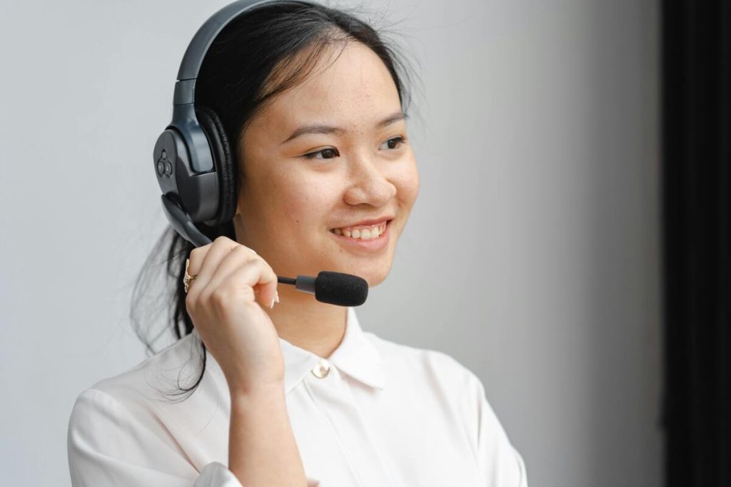 Support representative wearing a headset managing calls to enhance customer service response time