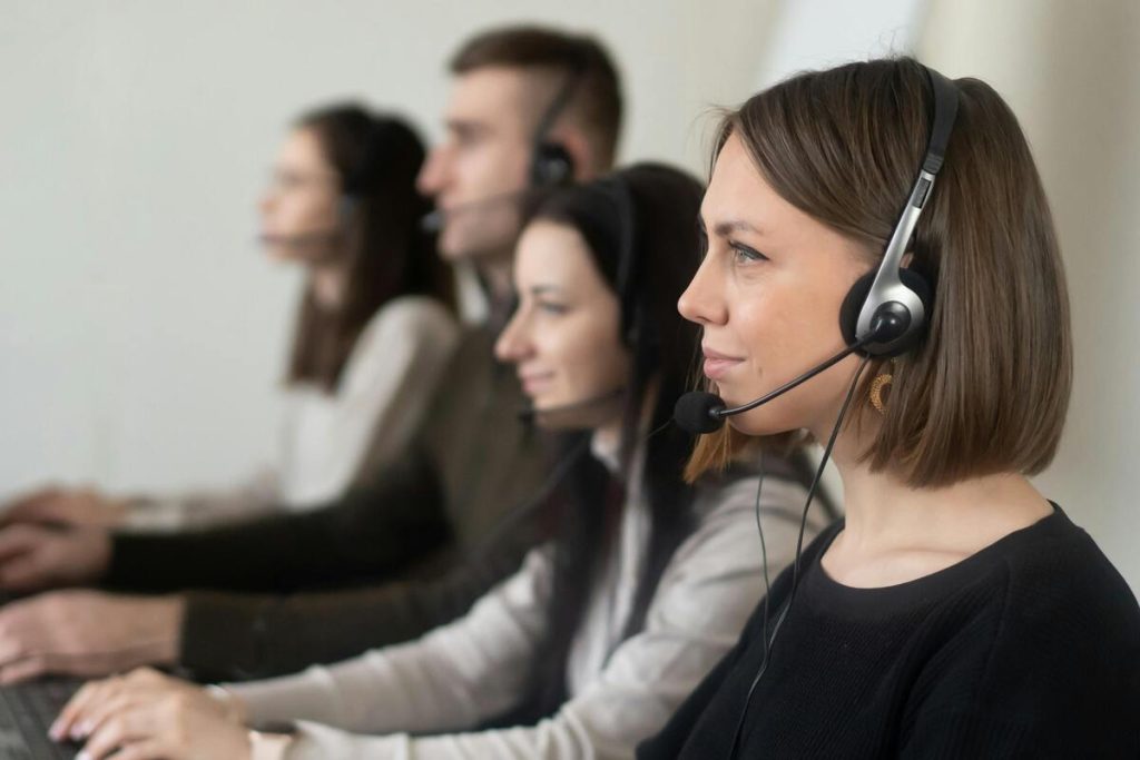 Call center agents providing customer service outsourcing for small business