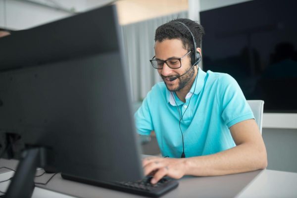 Call center agent handling inquiries supported by business process outsourcing solutions