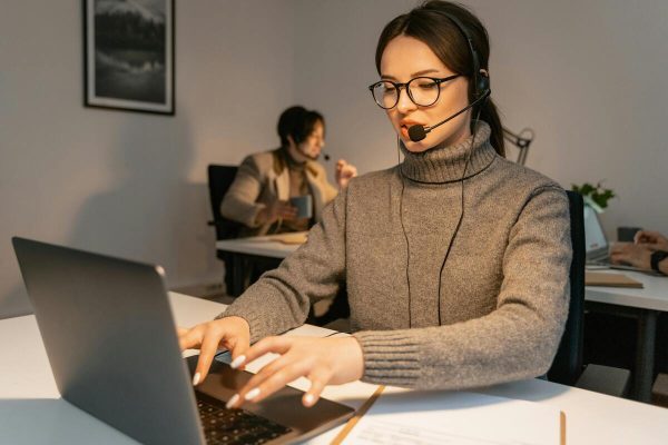 Call center agent providing software support outsourcing services