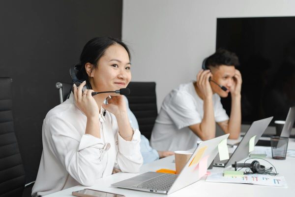 Call center team using strong telephone etiquette to handle customer inquiries