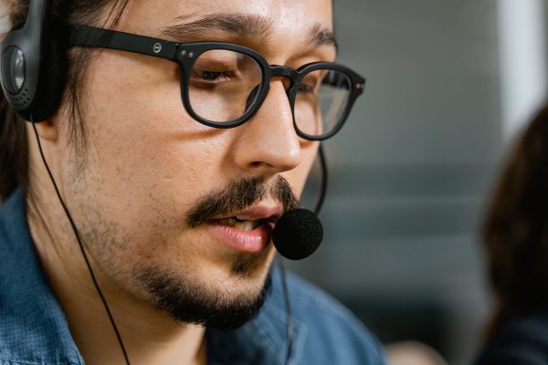 Back office support services agent assisting customers by phone